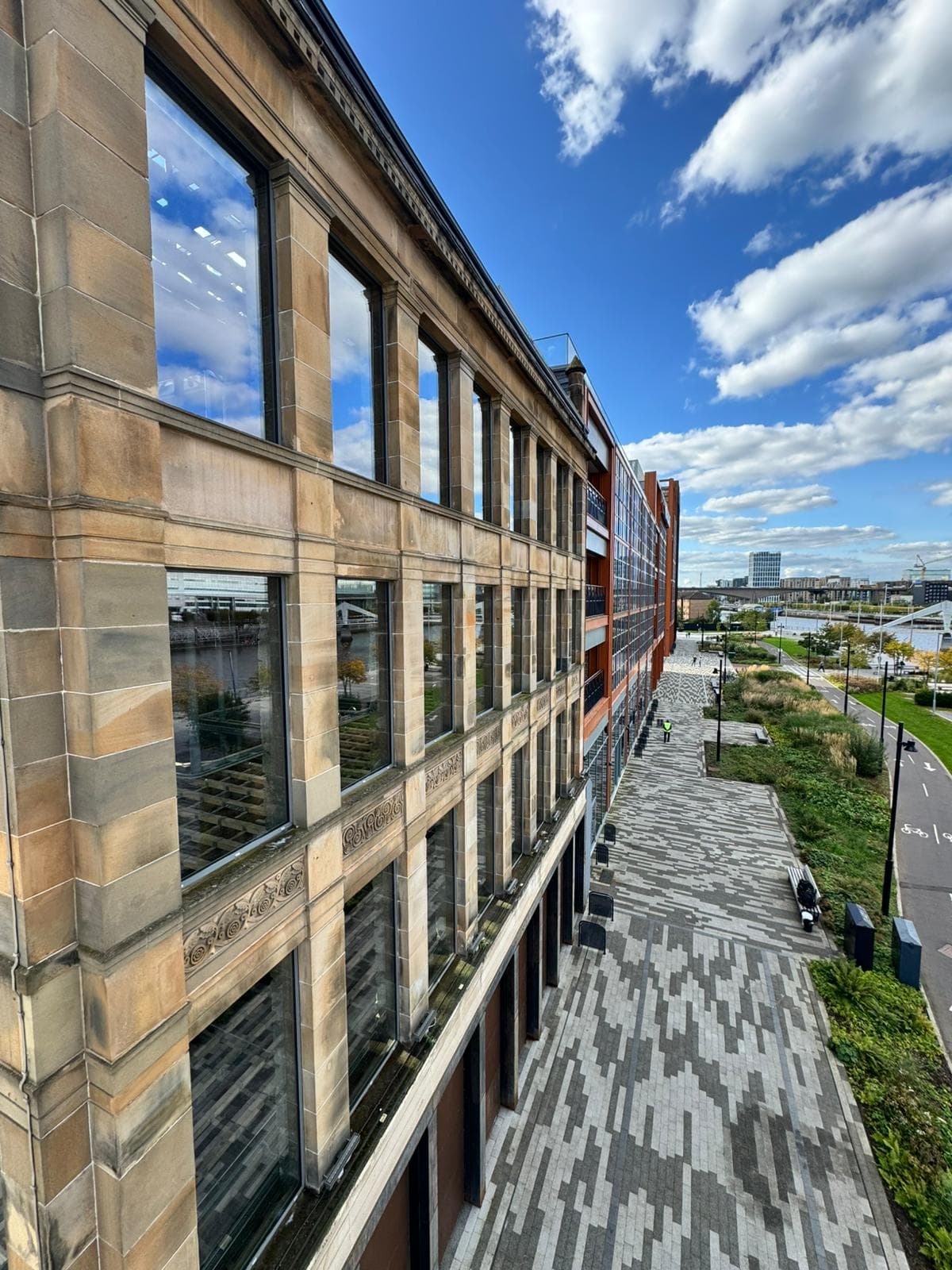 Heritage sandstone building with clean windows at Barclays campus