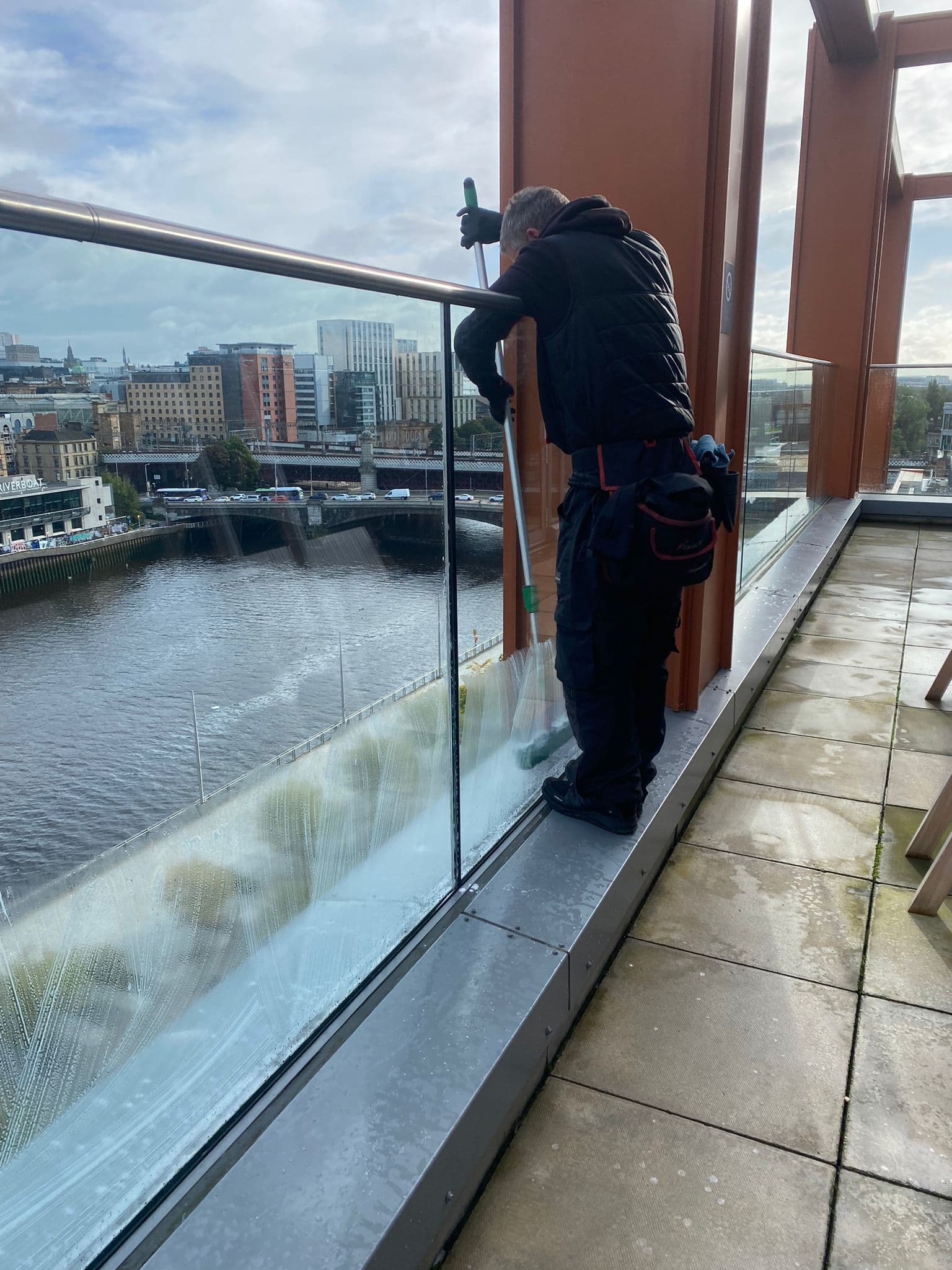 Operative cleaning riverside balcony glass