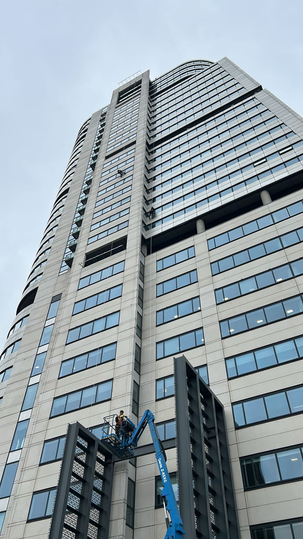 Rope access team working on high-rise building
