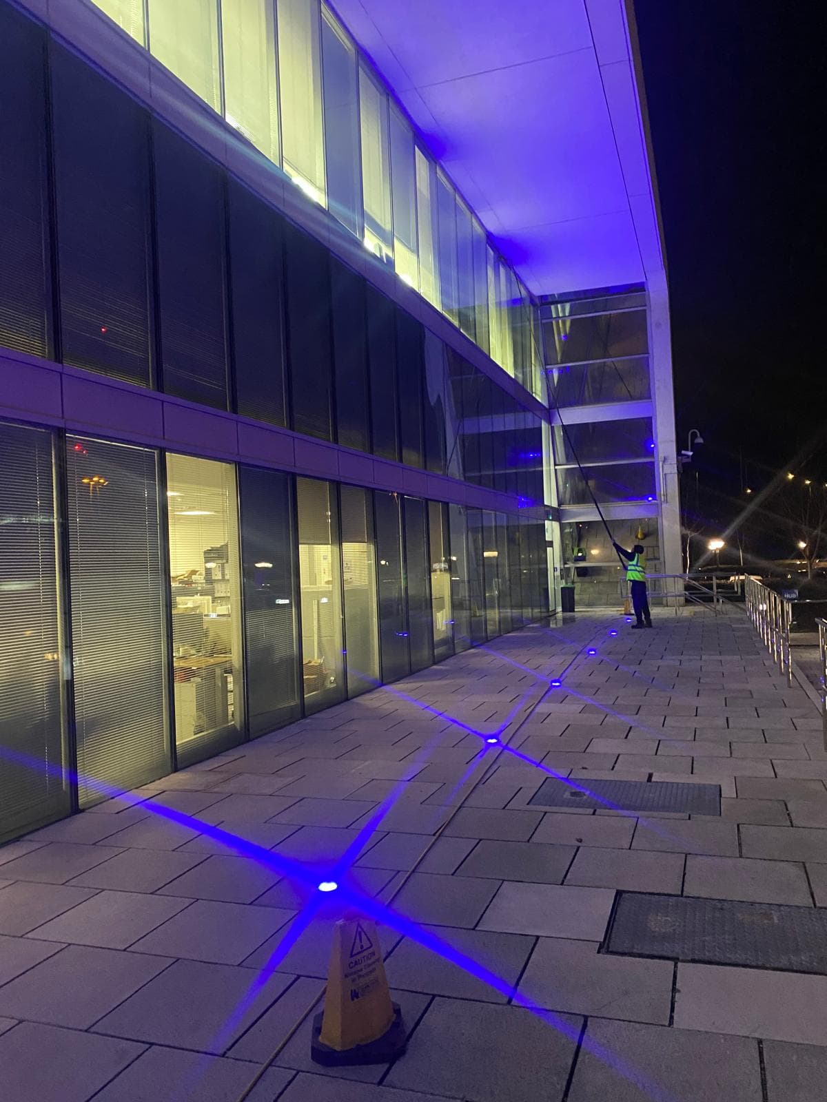 IRATA certified rope access technicians performing commercial building maintenance