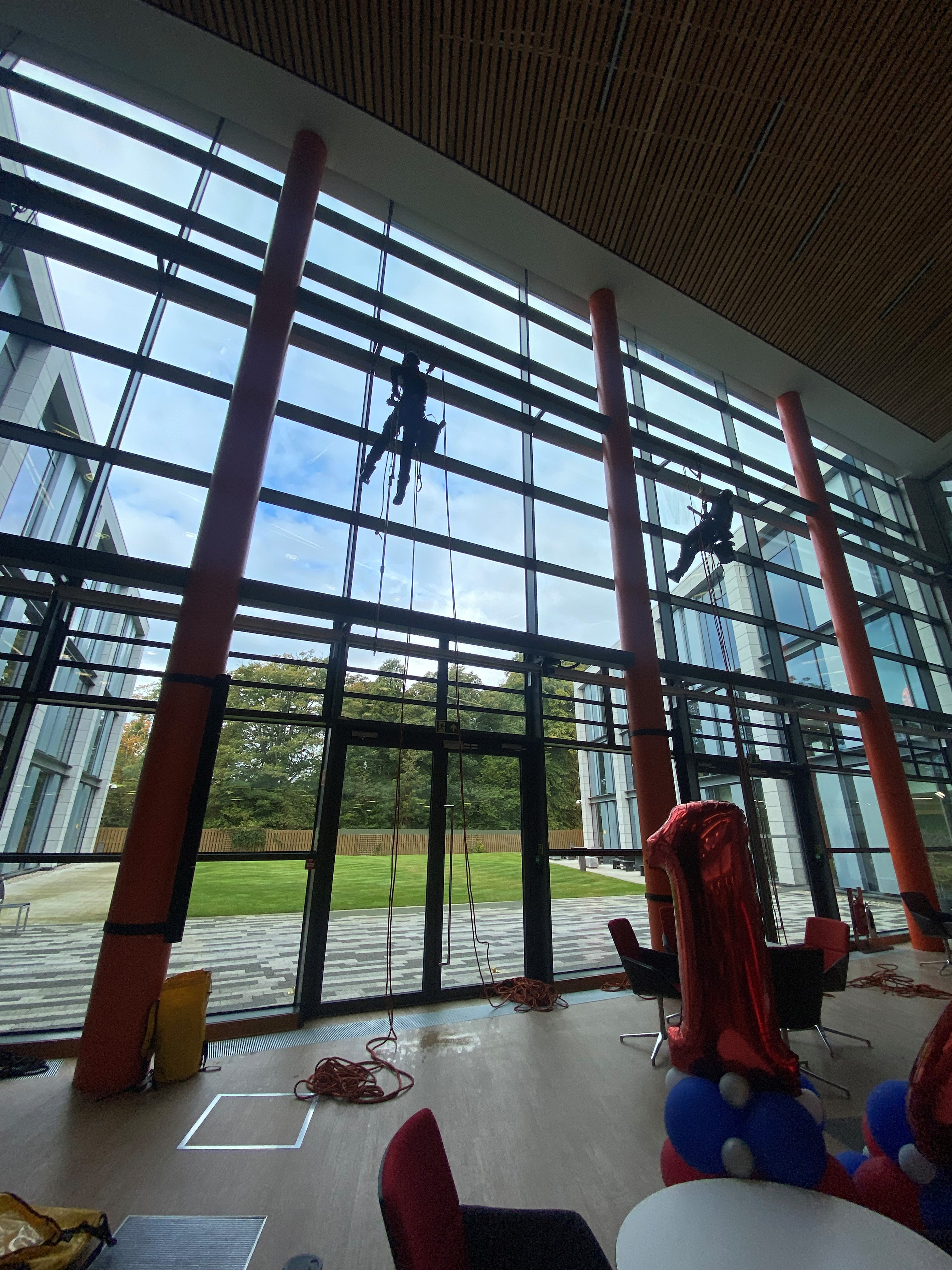 Rope access technicians on Aberdeen commercial building atrium