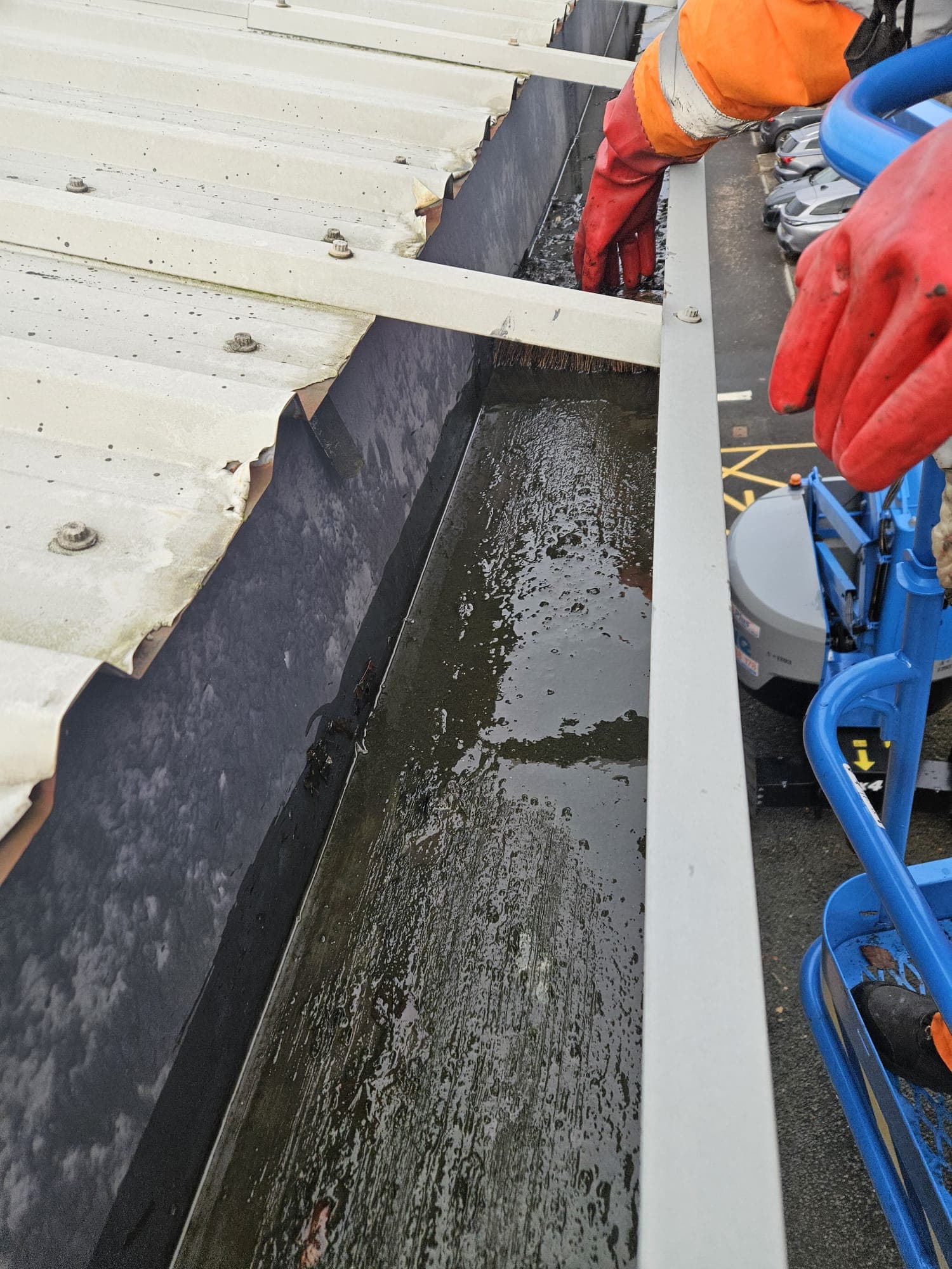 Commercial gutter cleaning using Skyvacs high-reach vacuum system